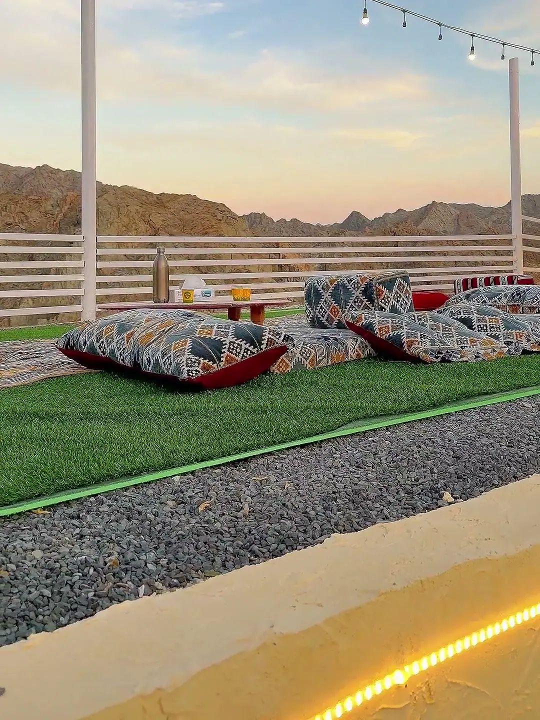 Cliff House outdoor majlis on the lawn, with the mountains behind